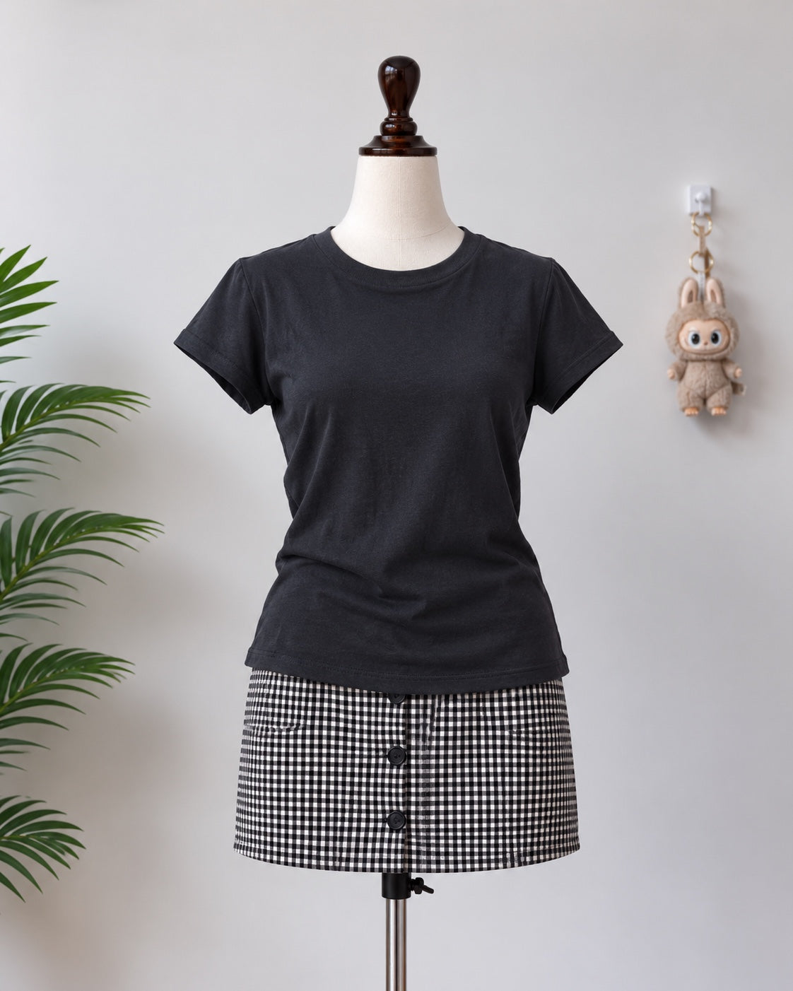 Black short sleeve top on mannequin