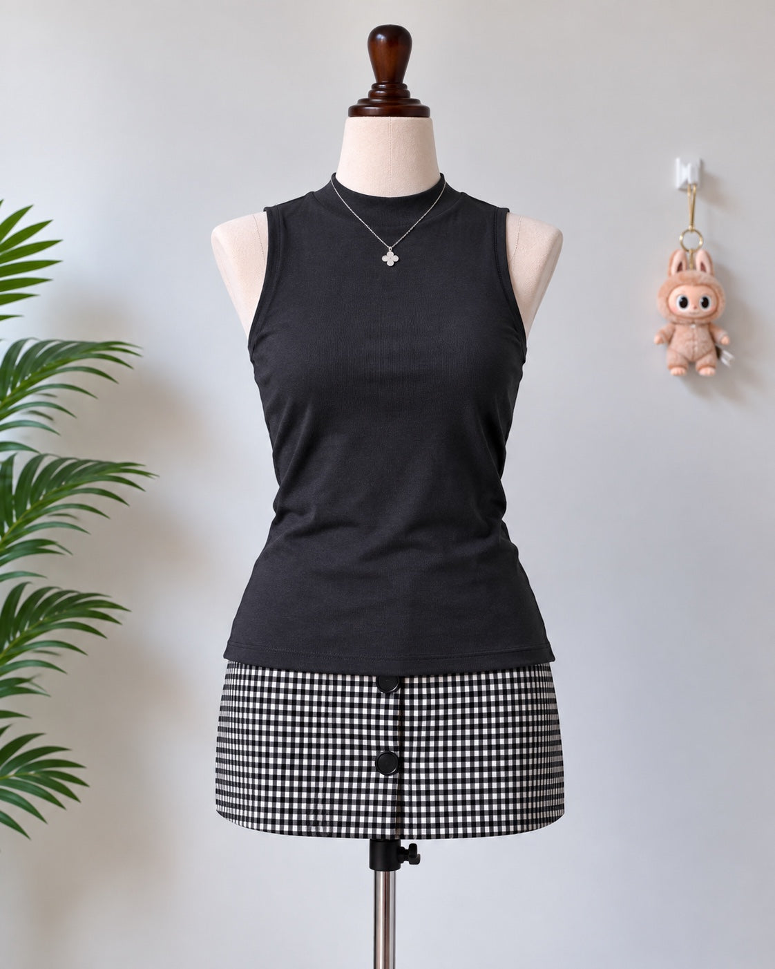 Black sleeveless mock neck long top