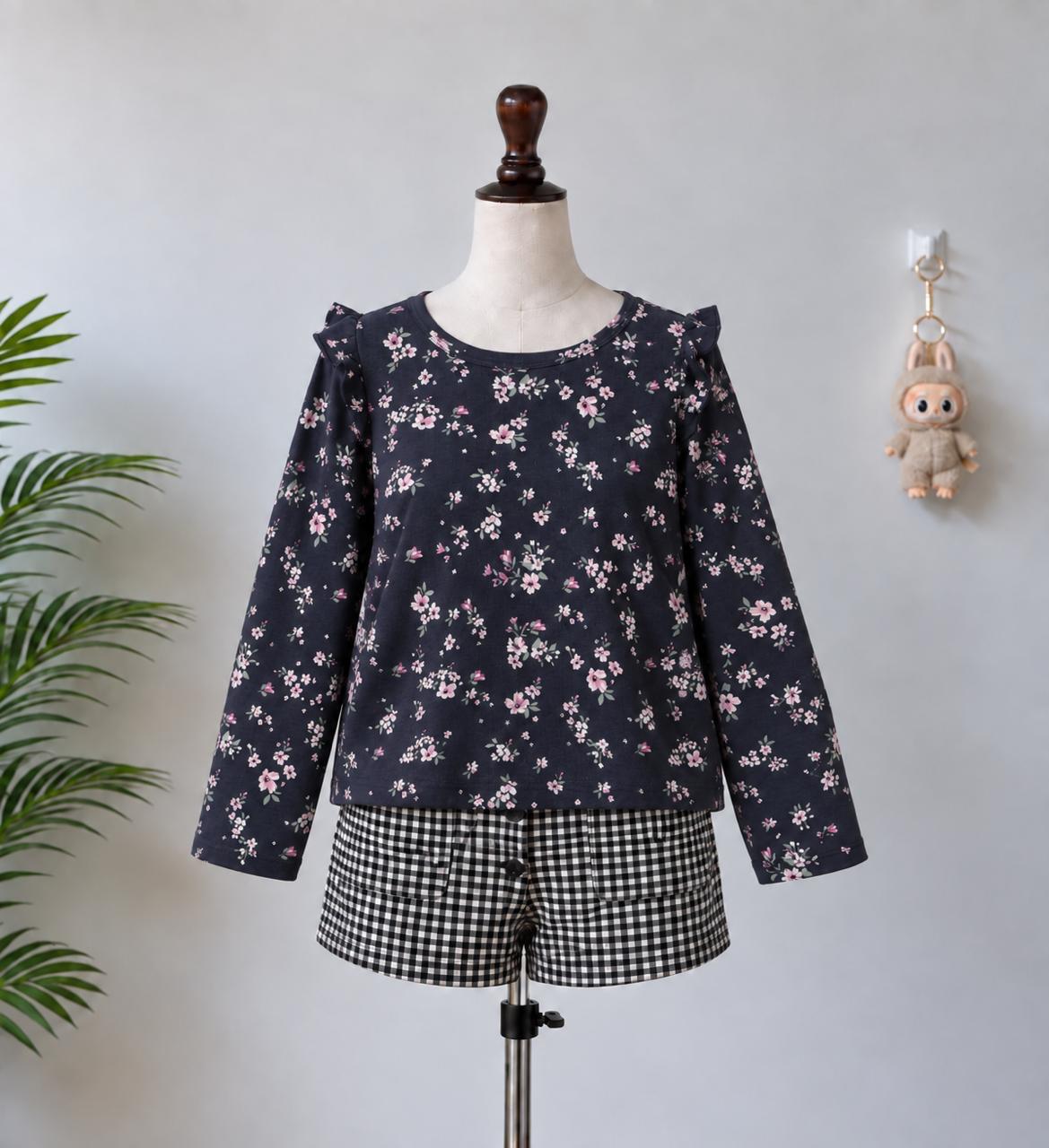Black floral top on mannequin