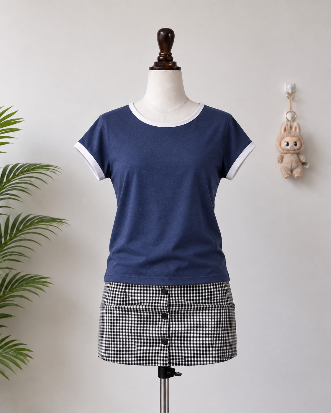 Navy blue ringer T-shirt with white trim on mannequin