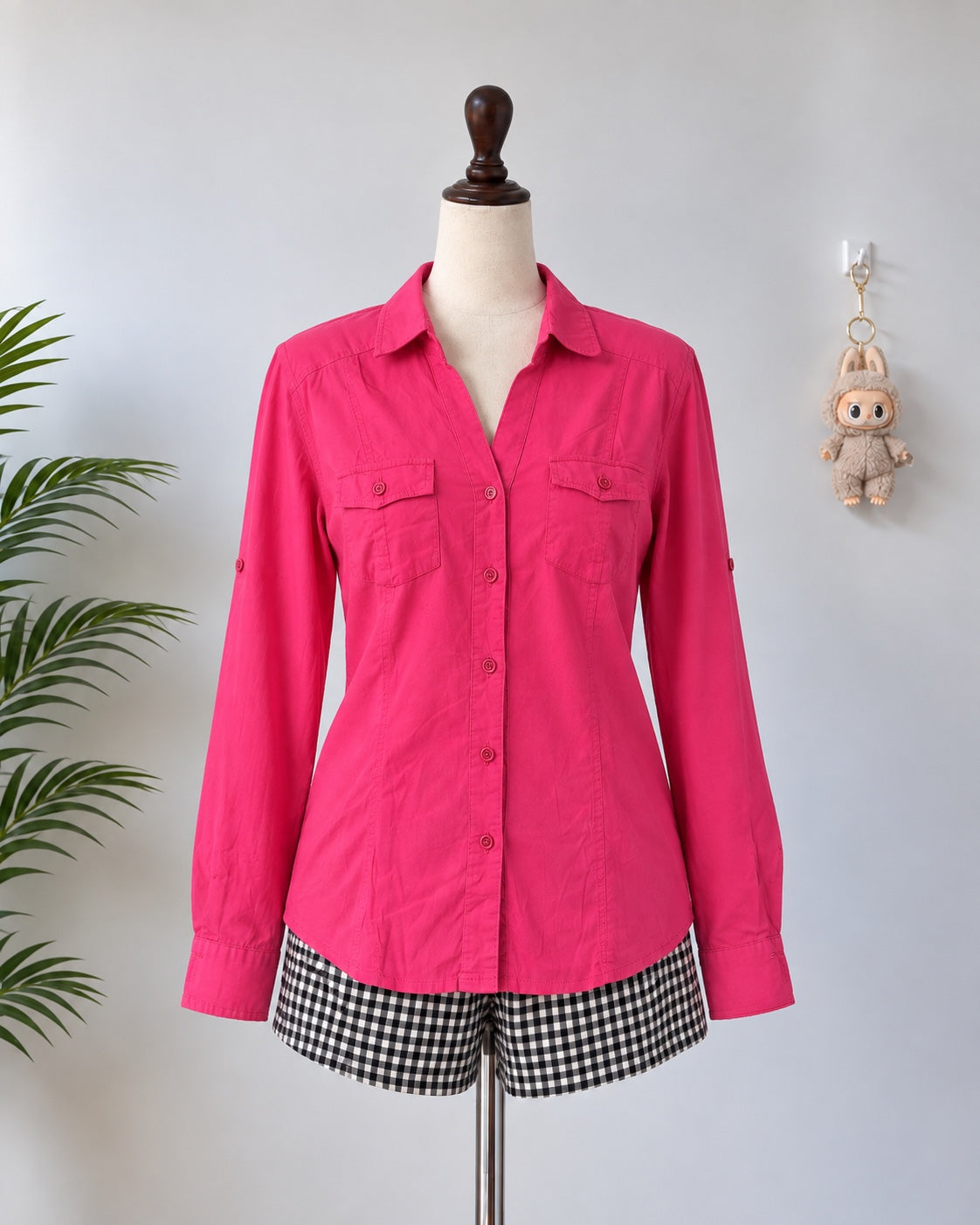 Pink long sleeve pocket shirt on mannequin