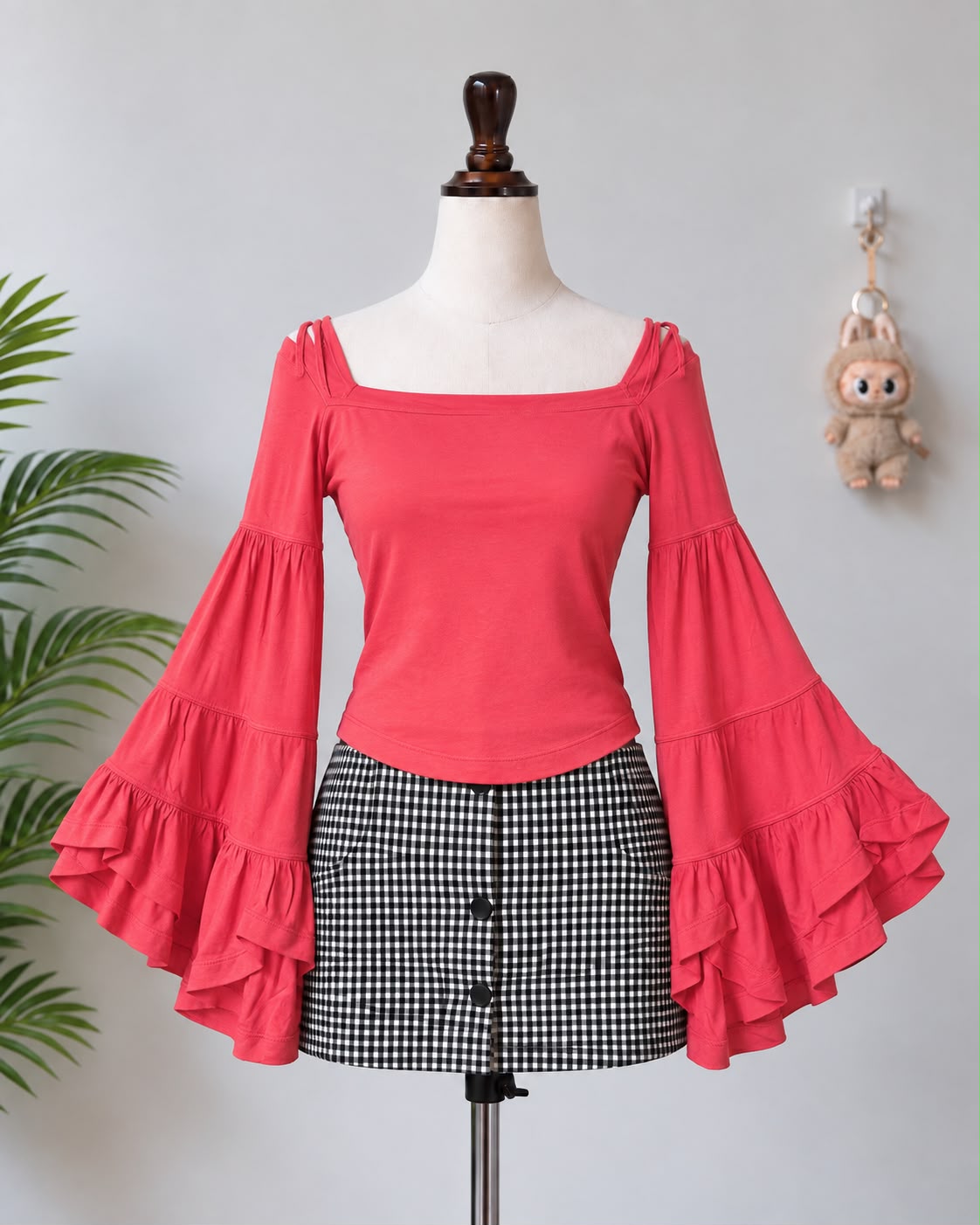 Coral bell sleeve top on Lucky Girl mannequin